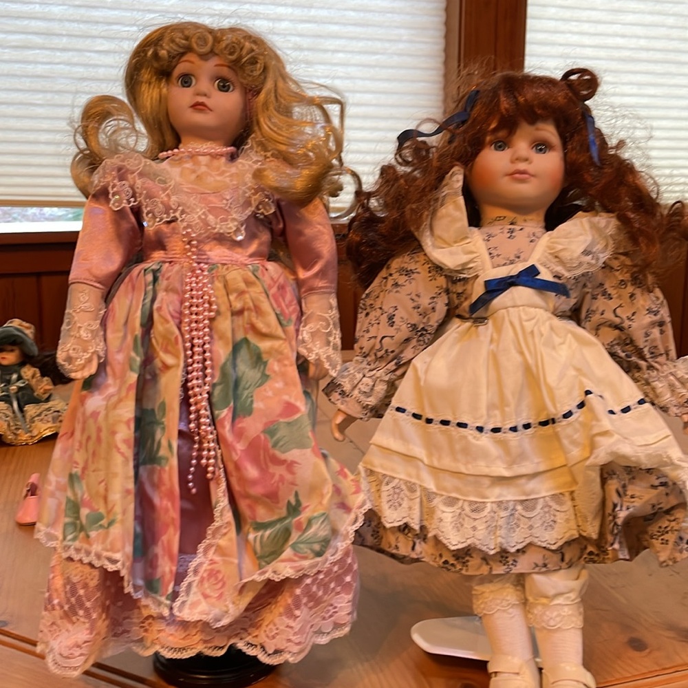 2 Geppeddo porcelain dolls with stands.